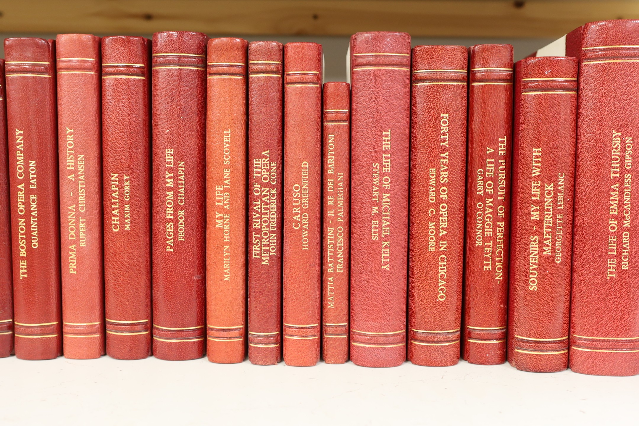 A collection of 19th and 20th century works on opera related biographies, autobiographies and histories, bound in red morocco by EA Weeks, London, approx 66 altogether